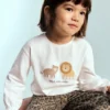 Baumwoll-T-Shirt mit gesticktem Löwen Baumwoll-T-Shirt mit gesticktem Löwen