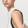 Bluse mit drapiertem Kragen und kontrastierender Borte Bluse mit drapiertem Kragen und kontrastierender Borte