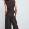 Bluse mit V-Ausschnitt und Schleifen Bluse mit V-Ausschnitt und Schleifen