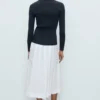 Gerippte Strickjacke mit Reverskragen Gerippte Strickjacke mit Reverskragen