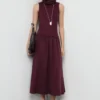 Kleid mit kombiniertem Trichterkragen Kleid mit kombiniertem Trichterkragen