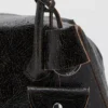 Lederschultertasche mit Anhängern