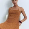 Lurex-Kleid mit gekreuztem Rücken Lurex-Kleid mit gekreuztem Rücken