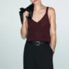Lurex-Strickoberteil mit V-Ausschnitt Lurex-Strickoberteil mit V-Ausschnitt