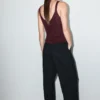 Lurex-Strickoberteil mit V-Ausschnitt Lurex-Strickoberteil mit V-Ausschnitt