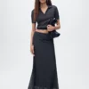 Lurex-Strickrock mit Falten Lurex-Strickrock mit Falten