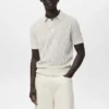 Polohemd aus Baumwollstrick mit Spitzenmuster Polohemd aus Baumwollstrick mit Spitzenmuster