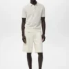 Polohemd aus Baumwollstrick mit Spitzenmuster Polohemd aus Baumwollstrick mit Spitzenmuster