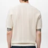 Polohemd aus Baumwollstrick mit Spitzenmuster Polohemd aus Baumwollstrick mit Spitzenmuster
