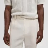 Schmal geschnittene Leinenhose mit Falten Schmal geschnittene Leinenhose mit Falten