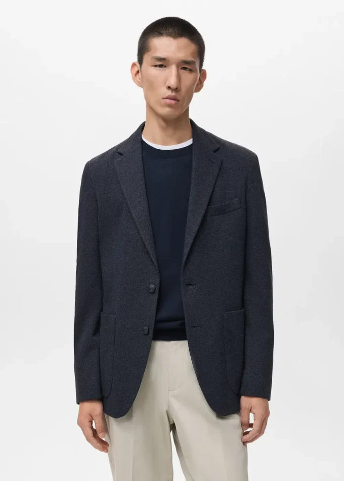 Schmal geschnittene, taillierte Jacke mit Fischgrätenmuster Schmal geschnittene, taillierte Jacke mit Fischgrätenmuster