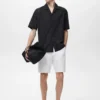 Shirt mit gestickten Lochdetails Shirt mit gestickten Lochdetails