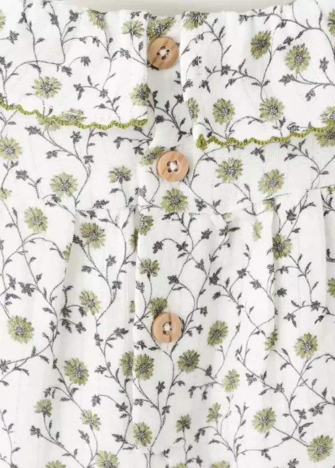 Strampler mit Blumenmuster