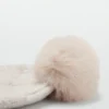 Strickmütze mit Bommel
