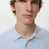 Strukturiertes, schmal geschnittenes Polohemd aus Strick Strukturiertes, schmal geschnittenes Polohemd aus Strick
