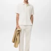 Strukturiertes Strick-Poloshirt Strukturiertes Strick-Poloshirt