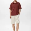 Strukturiertes Strick-Poloshirt Strukturiertes Strick-Poloshirt