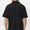 Strukturiertes Strick-Poloshirt Strukturiertes Strick-Poloshirt