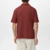 Strukturiertes Strick-Poloshirt Strukturiertes Strick-Poloshirt
