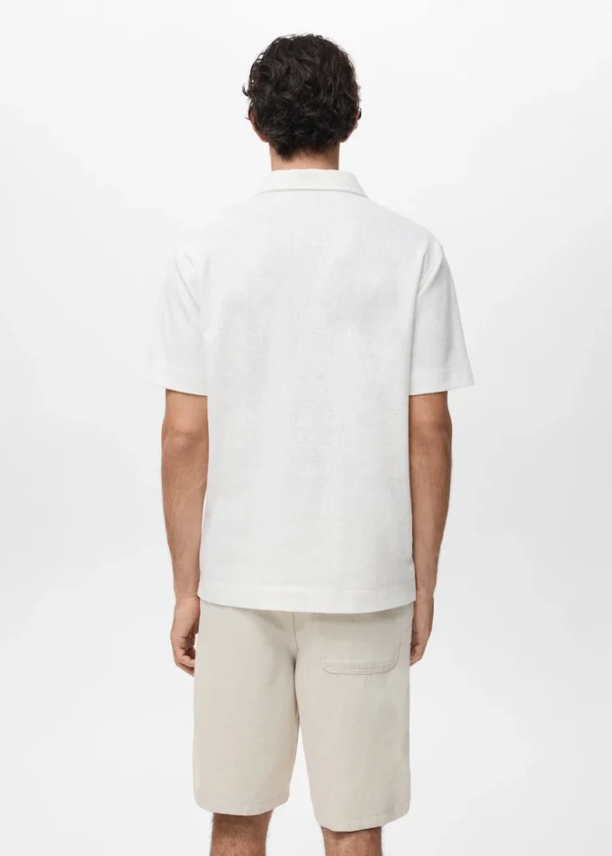 Strukturiertes Strick-Poloshirt Strukturiertes Strick-Poloshirt