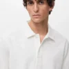 Strukturiertes Strick-Poloshirt Strukturiertes Strick-Poloshirt