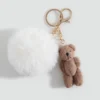 Teddybär-Schlüsselanhänger mit Bommel Teddybär-Schlüsselanhänger mit Bommel
