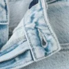 Weite Jeans mit herzförmigen Taschen Weite Jeans mit herzförmigen Taschen